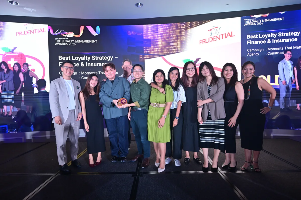 The Moments That Matter team accepting Gold for Best Loyalty Strategy, Finance & Insurance.