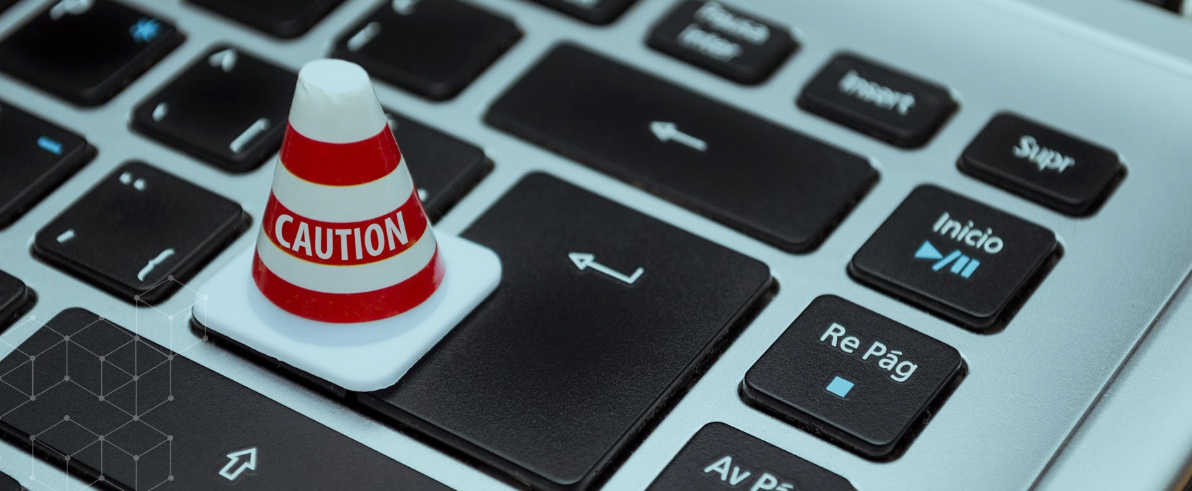 "Caution" cone resting on keyboard