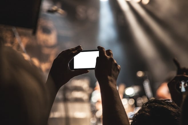 hands-smartphone-taking-photo-festival-large.jpg